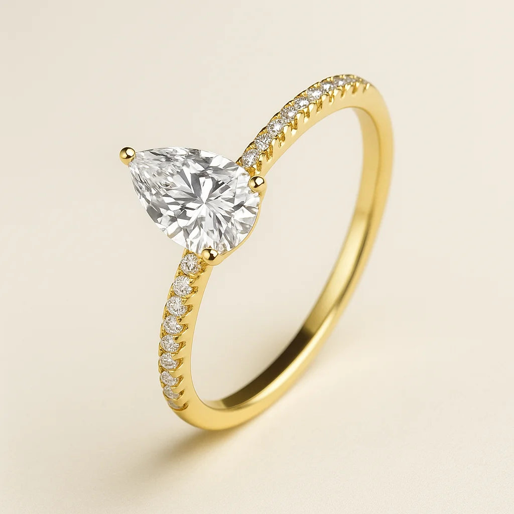 Gold Plated ring with a clear gemstone on a beige background