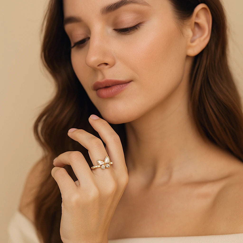 Gold-plated butterfly ring with white enamel wings, crystal inlays, and pearl accents on a 925 silver band