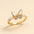 Gold-plated butterfly ring with white enamel wings, crystal inlays, and pearl accents on a 925 silver band