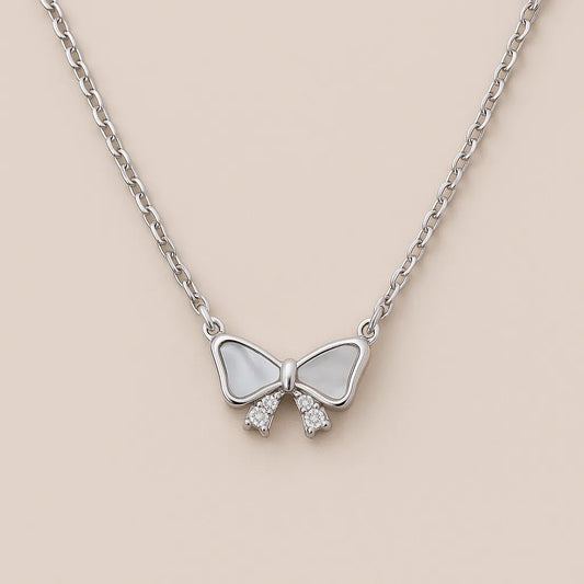 Elegant silver bow necklace with mother-of-pearl center

