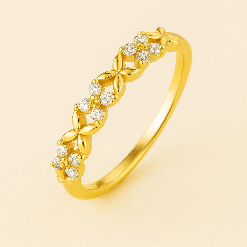 Golden ring with diamond accents on a beige background