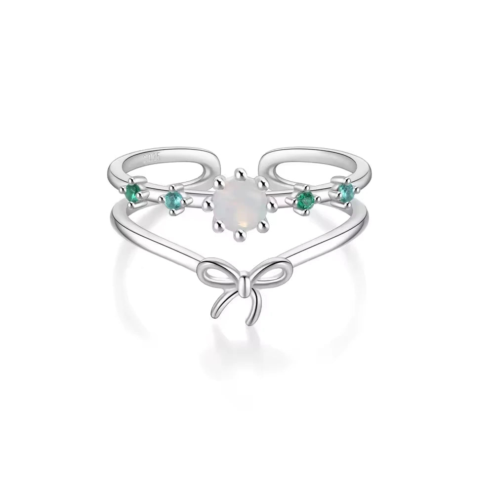 925 silver ring with butterfly and synthetic opal stone detail on white background