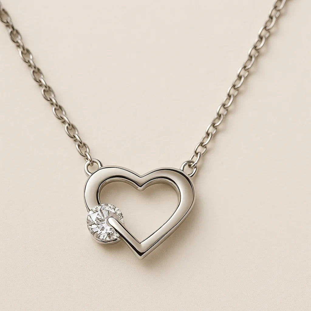 A beautiful sterling silver necklace with a heart-shaped pendant holding a single sparkling cubic zirconia stone.