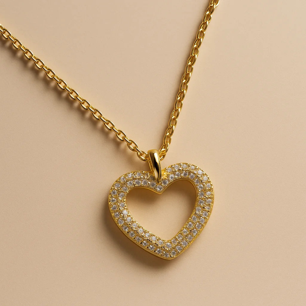 A 925 sterling silver and a gold-plated necklace, each with a heart-shaped pendant completely paved in sparkling cubic zirconia.