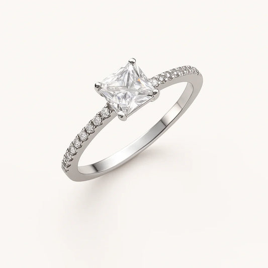 A sparkling princess-cut solitaire 925 sterling silver ring with pavé accents.