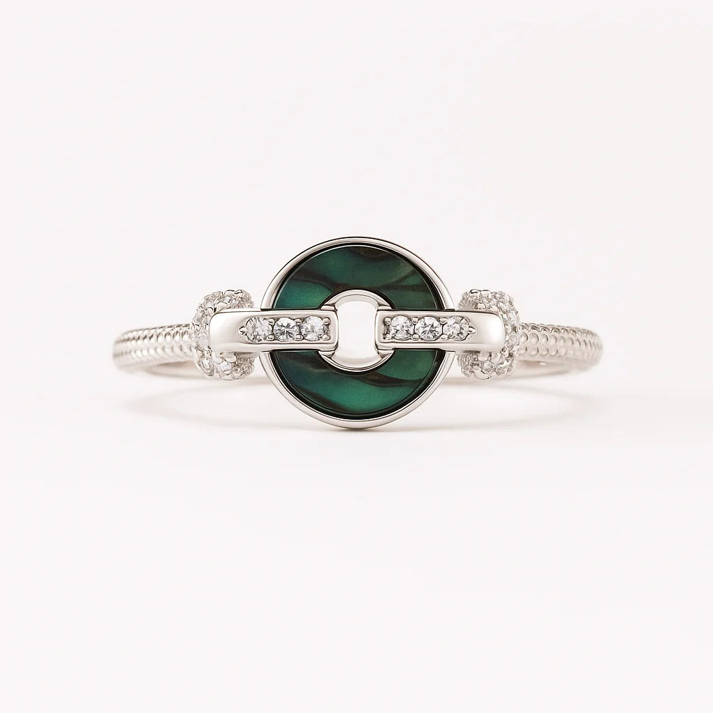 A striking 925 sterling silver ring with a central malachite stone and sparkling accents.