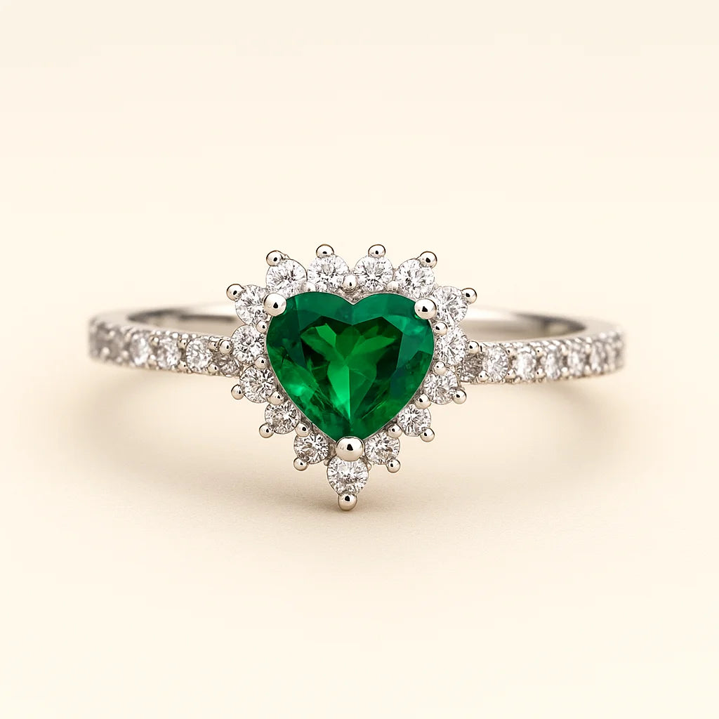 A stunning 925 sterling silver ring featuring a heart-shaped green stone surrounded by a halo of cubic zirconia.