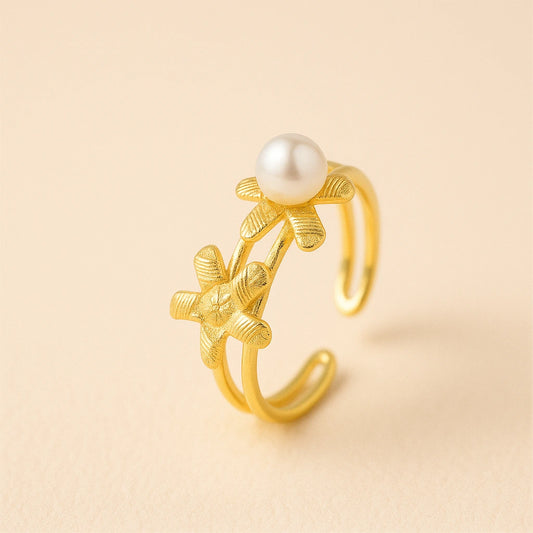 gold-plated-925-silver-ring-with-freshwater-pearl on a beige background
