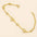 gold-plated heart charm bracelet featuring pavé-set heart charms and cubic zirconia stones.