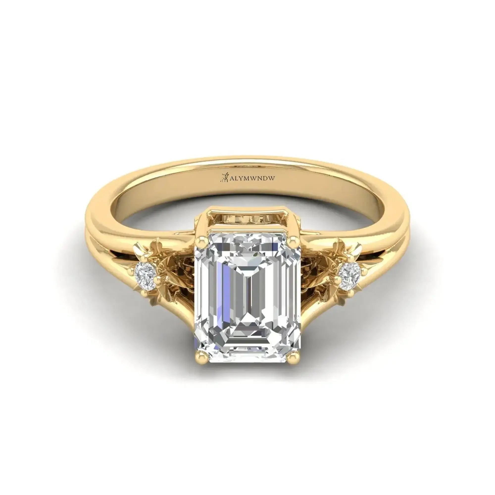 Lab grown diamond engagement ring in yellow gold, featuring an emerald cut diamond and side stones.