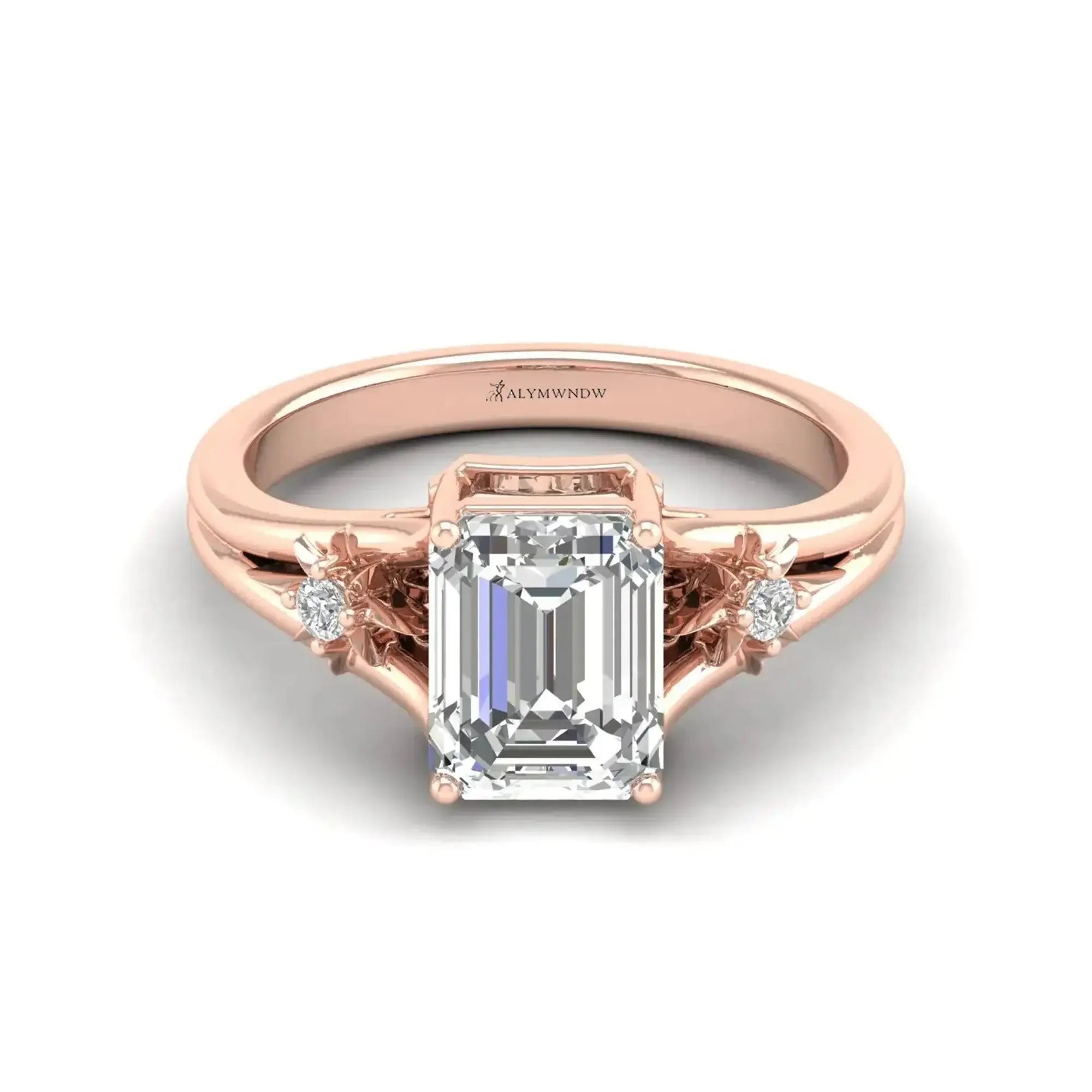 lab grown diamond engagement ring featuring an emerald cut center stone in rose gold setting.