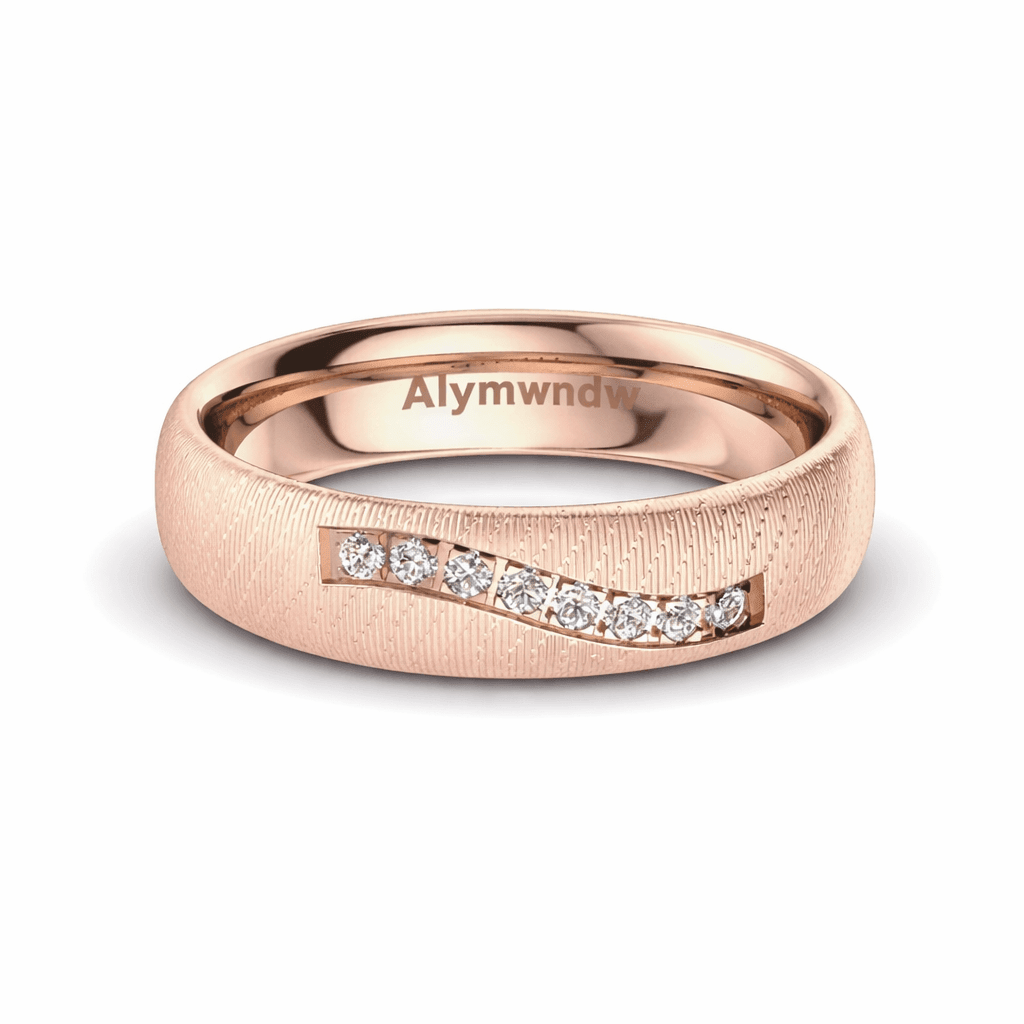 Luxury wedding rings in rose gold with diamond accents by Alymwndw, showcasing timeless elegance.