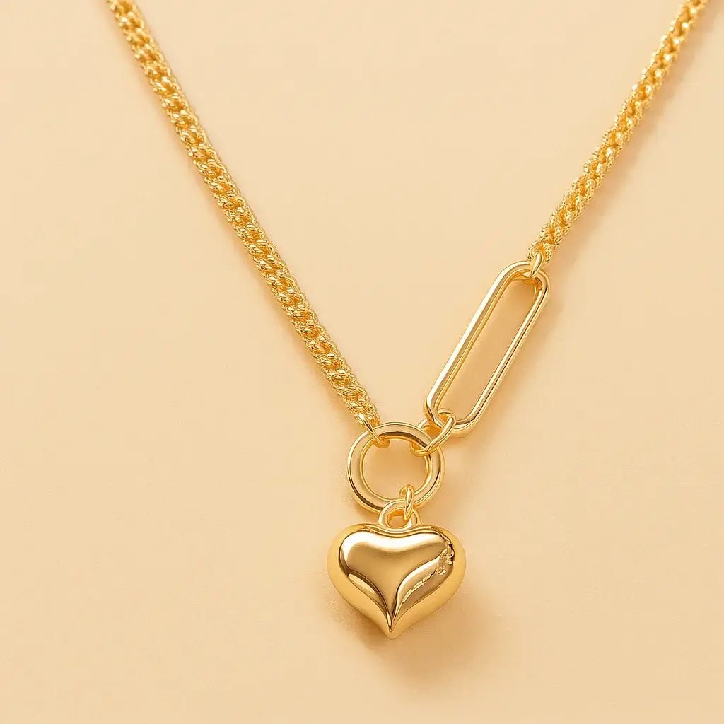 modern love silver necklace featuring a polished heart pendant on a unique chain
