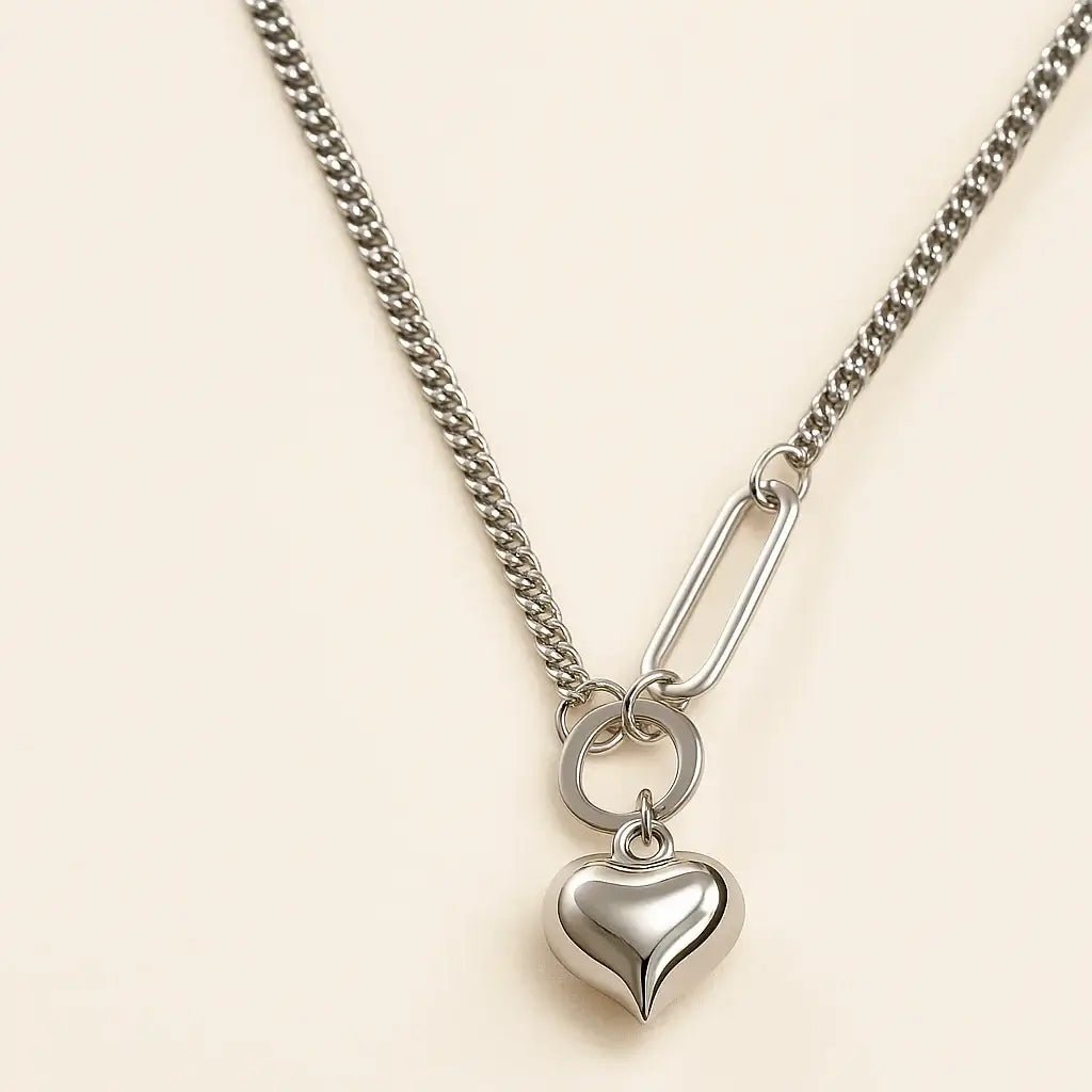 Modern love silver necklace with heart pendant on a stylish chain in polished 925 sterling silver.